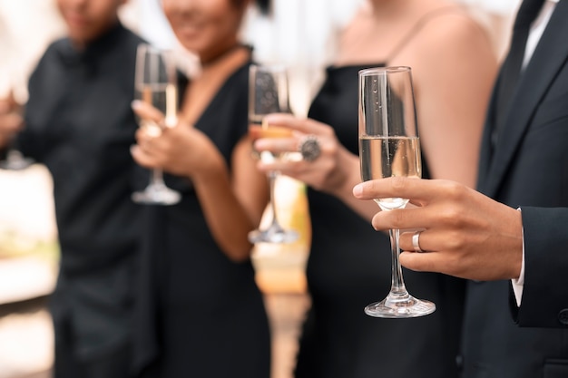 Photo guests having champagne at a wedding reception