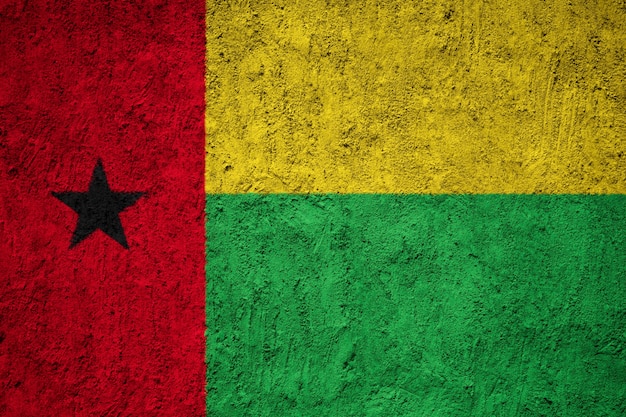 Guinea-Bissau flag painted on grunge wall