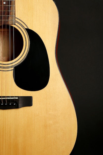 Guitar on black background closeup