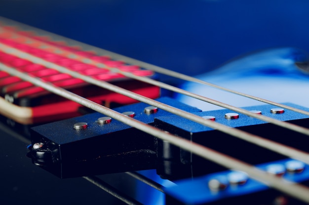 Guitar fingerboard with strings photo in dark