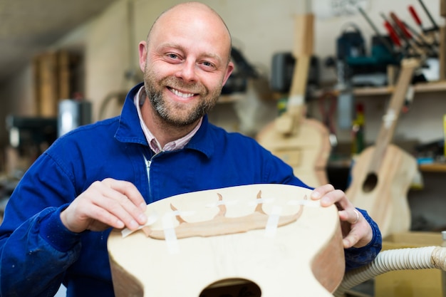 Guitar-maker at workshop&#xA;