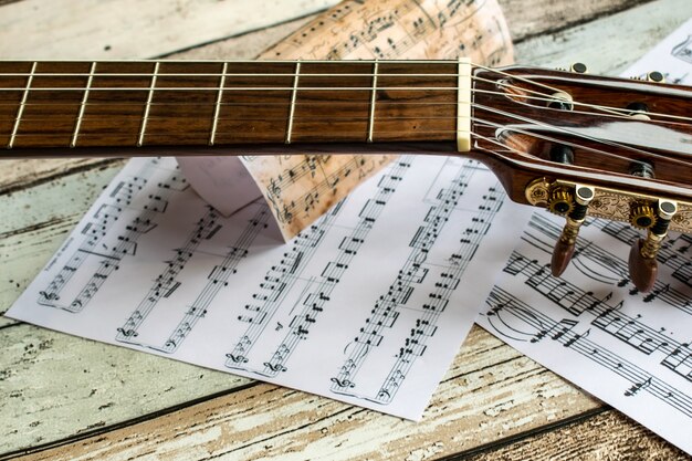 guitar and music, guitar and music sheet, instrument, guitar and music notes