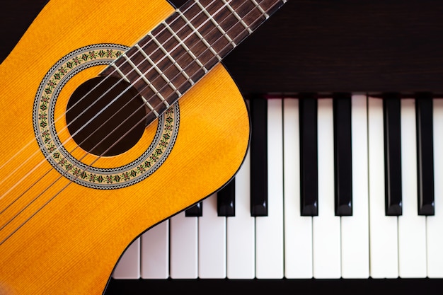 Guitar on piano. Classical music instrument. 