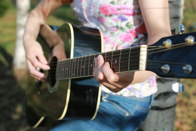 Guitar string woman hand outdoor