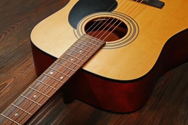 Guitar on wooden background