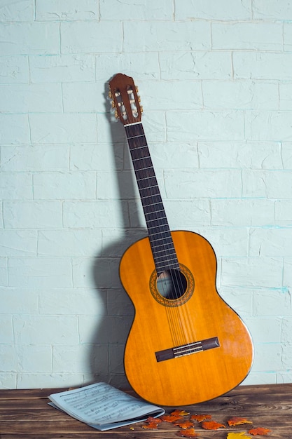 Guitar in wooden background