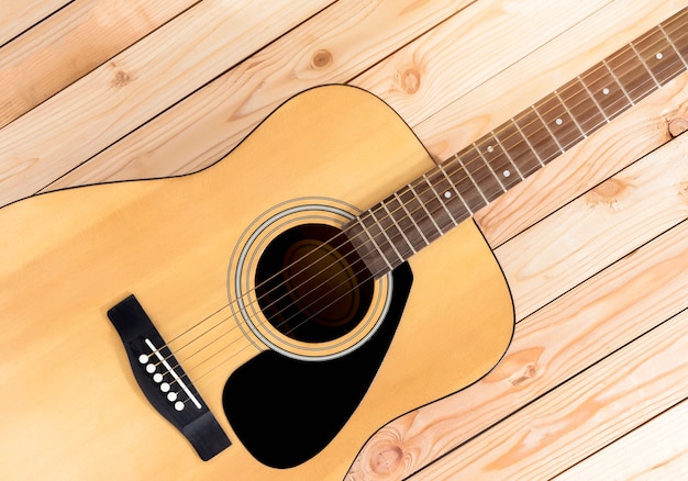 Guitar on a wooden table.