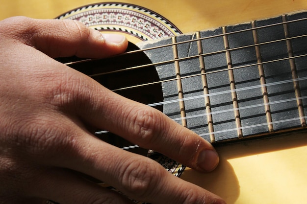 guitarist playing acoustic guitar