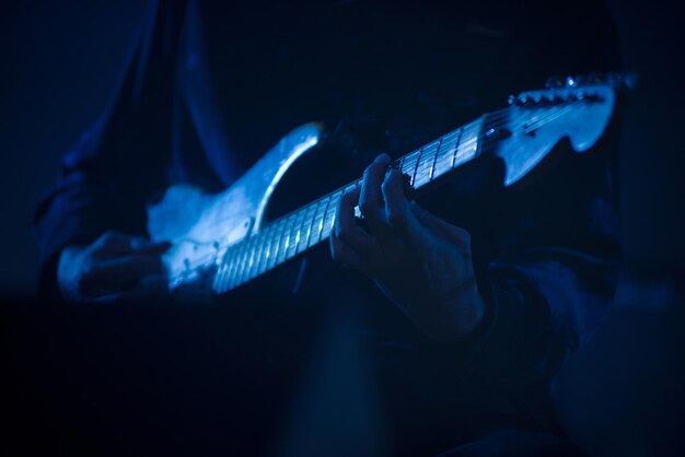 Guitarist playing live music on the stage