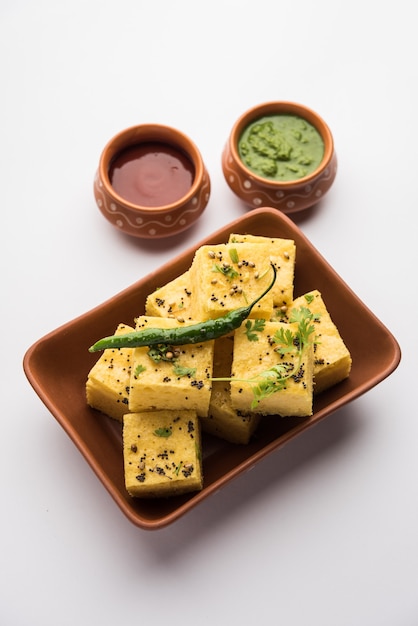 Gujarati Khaman Dhokla made using Chana Dal, served with Green chutney, selective focus