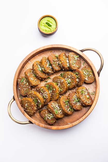 Gujarati snacks Muthiya or muthia is a steam cooked healthy food made using bottle gourd or doodhi or lauki