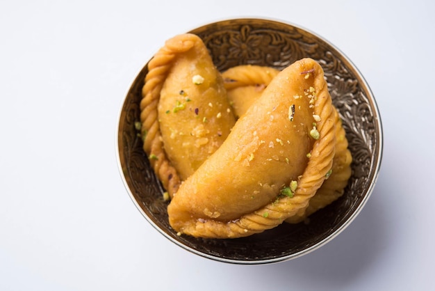 Gujiya - sweet dumplings made during the festival of holi and\
diwali, selective focus