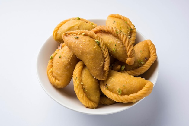 Gujiya - sweet dumplings made during the festival of holi and\
diwali, selective focus