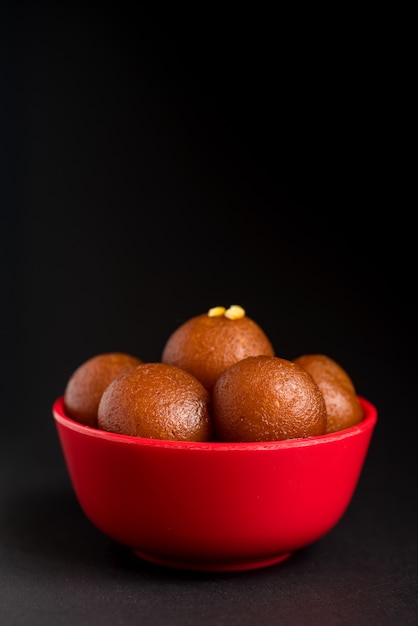 Gulab Jamun in bowl. Indian Dessert or Sweet Dish.