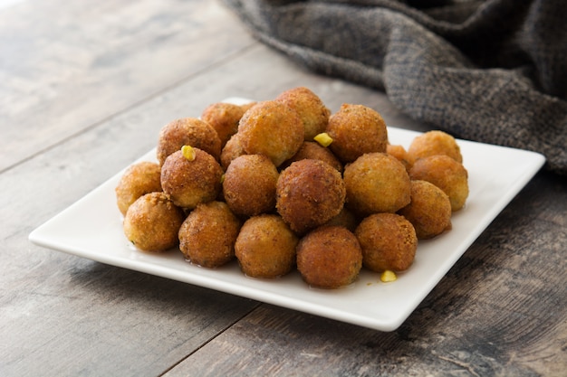 Gulab jamun on wooden table Traditional indian dessert.