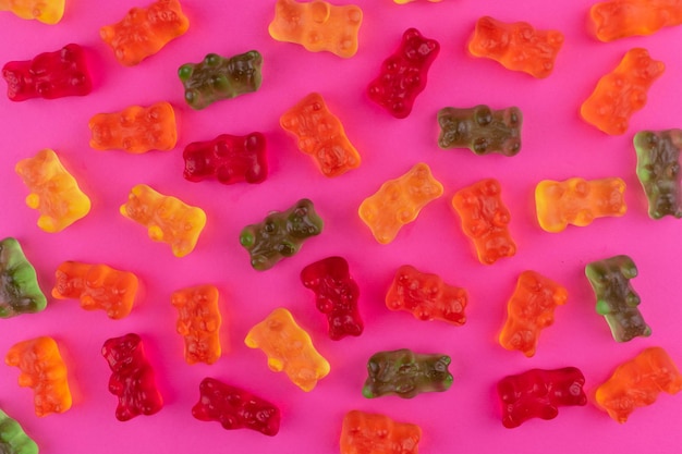 Gummy bears on a pink background