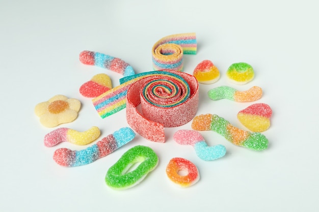 Gummy candies on white background, close up.