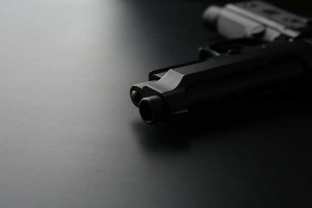 Gun on black background