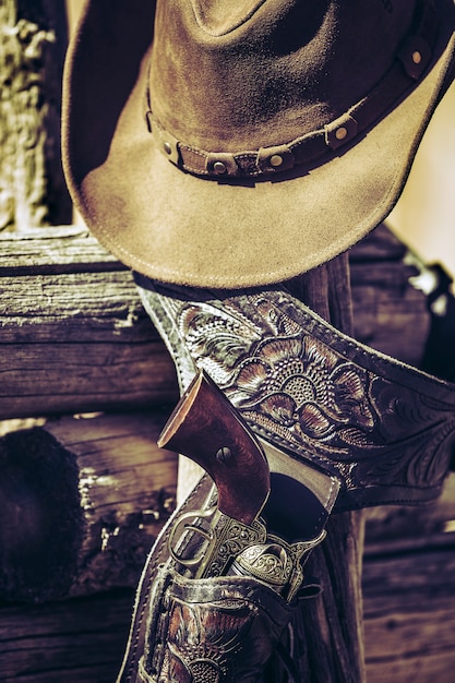 Gun and hat outdoor under sunlight