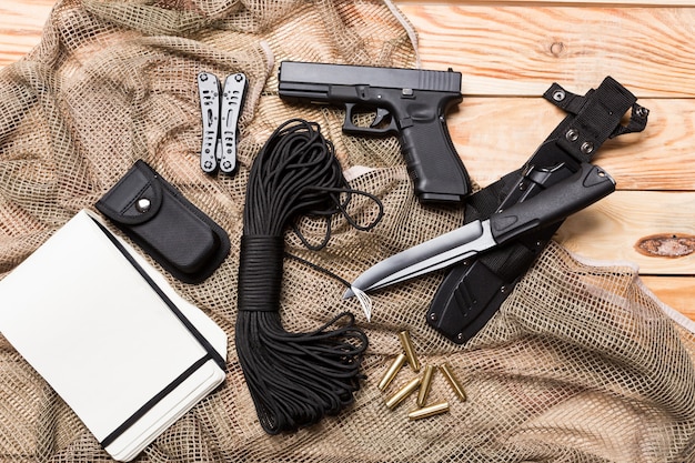 Photo gun, knife with sheath, compass