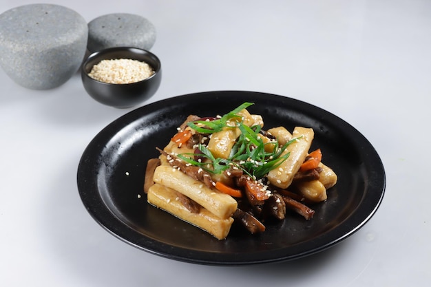 Gungjung Tteokbokki or Ddukbokki is Rice Cake, Beef, and Various Vegetables Stir Fry with Soy Sauce.