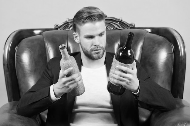 Guy choose wine to drink choice