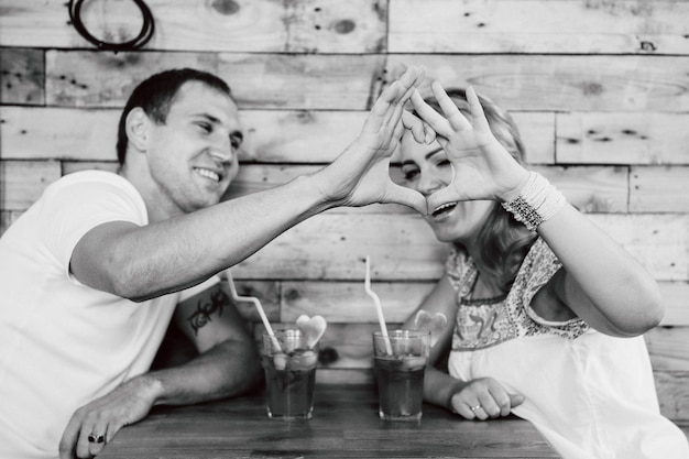 Photo guy and a girl meeting in a city stylized cafe