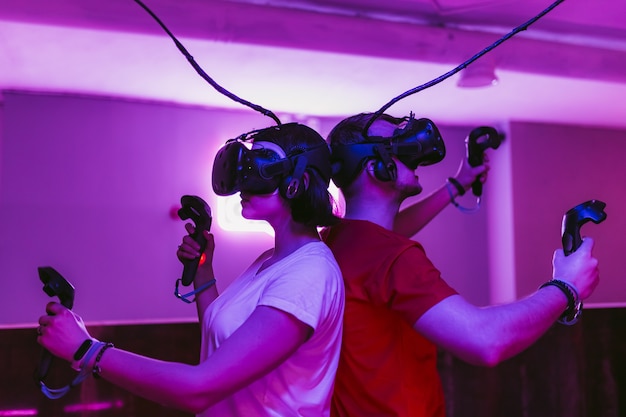 The guy and the girl play virtual reality games