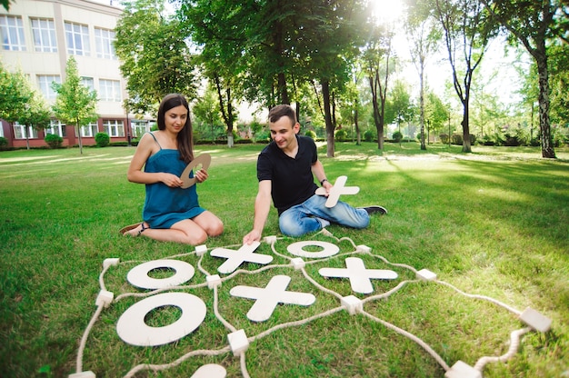 Guy and girl playing outdoors.