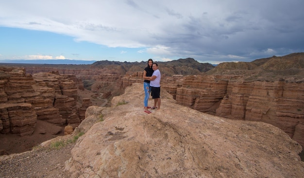 guy and girl on top of the mountain