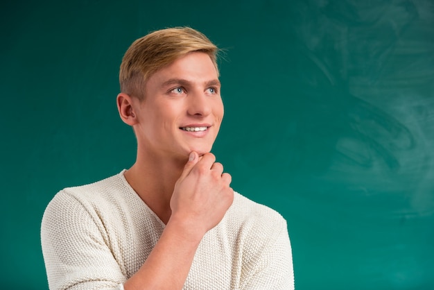 Guy on a green student blackboard.