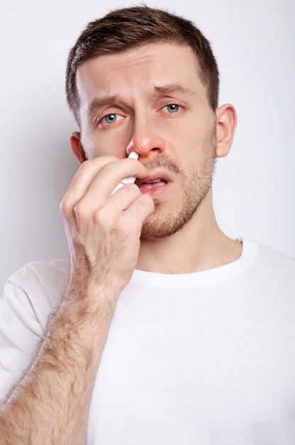 Guy has a runny nose and allergies