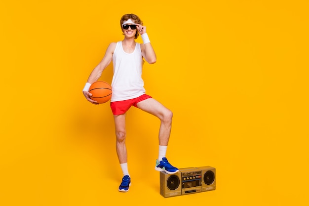 guy holding in hand orange ball step boombox