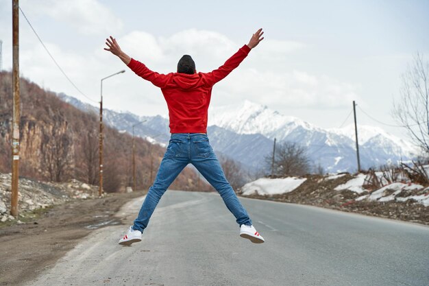 The guy is happy to travel to the mountains