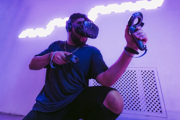 The guy is playing VR games