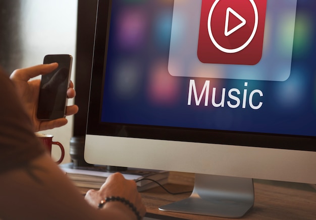 a guy listening to music on his computer