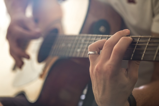 the guy playing the acoustic guitar