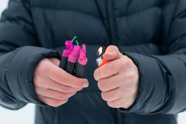 Guy sets fire to the flash noise firecrackers outdoors