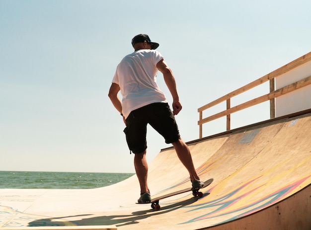 The guy skates on a ramp. tricks.