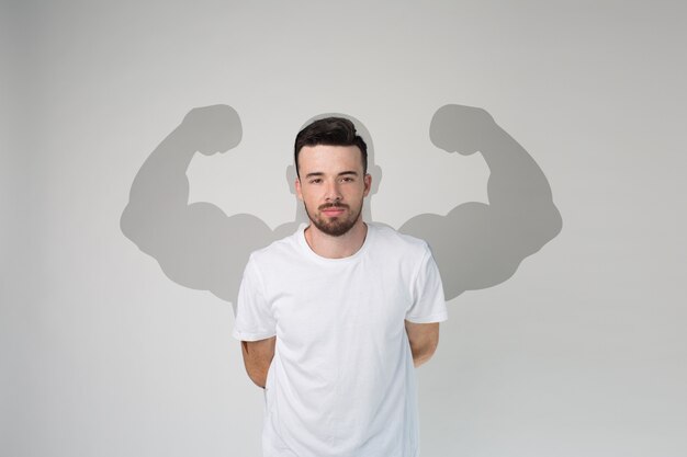 Photo guy in white shirt posing on camera