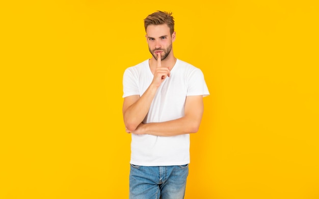 Guy with bristle keeping secret on yellow background lifestyle