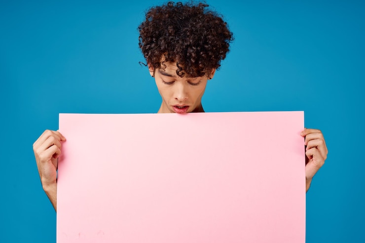 Photo guy with curly hair pink poster copy space advertising high quality photo