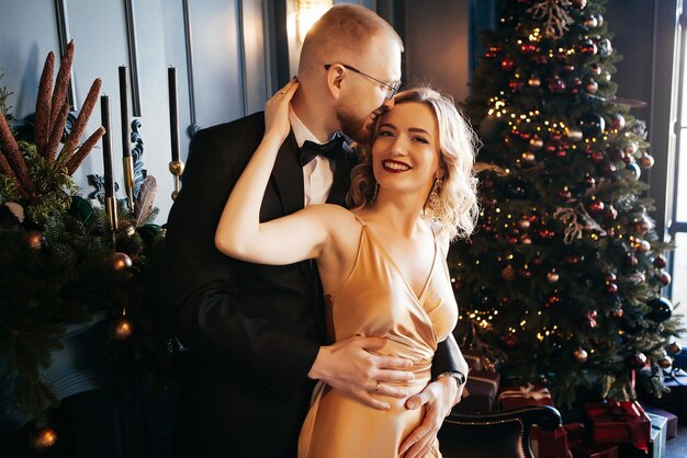 A guy with a girl is celebrating Christmas A loving couple enjoy each other on New Year's Eve New Year's love story