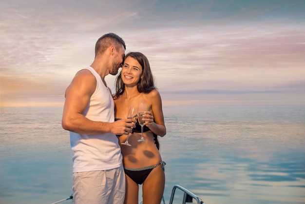 Guy with the girl relaxing on the yacht romantic trip couple drinking champagne loving couple relaxi