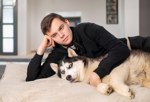 Guy with his Siberian Husky at home Love animals