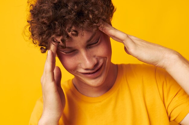 Guy with red curly hair youth style studio casual wear isolated background unaltered