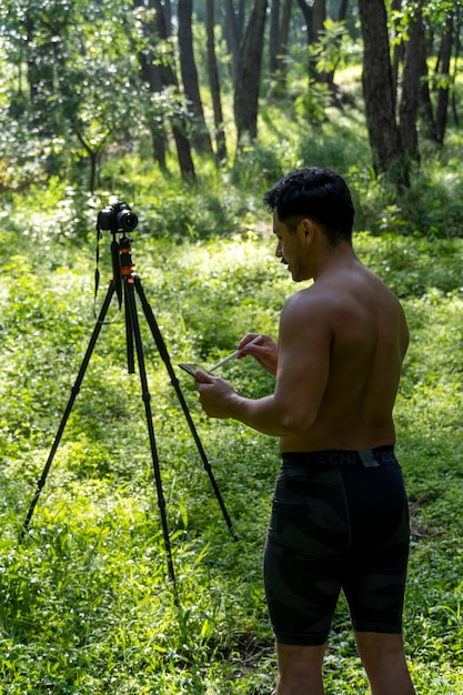 Guy with tablet making video blog on phone isolated person\
giving online classes man giving online classes with phone