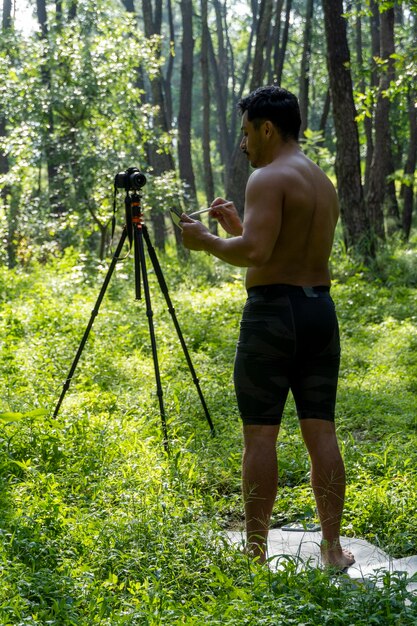 Guy with tablet making video blog on phone isolated person\
giving online classes man giving online classes with phone