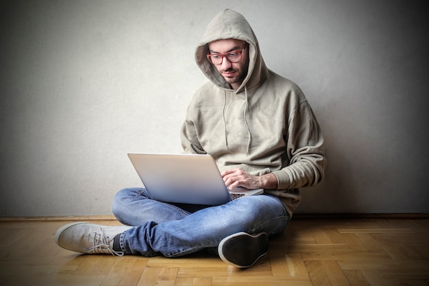 Guy working on a laptop