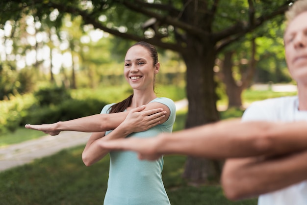 Guys in Light Sportswear. Male Workout at Park.